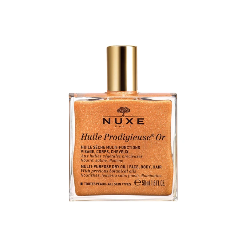 Bottle of Nuxe shimmering body oil, gold shimmer dry oil on a white background