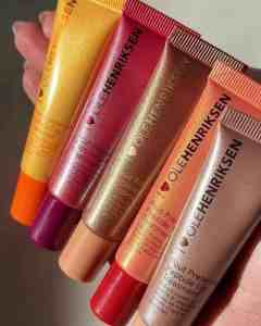 Lip gloss tubes from Ole Henriksen with shimmering colours, ideal for beauty lovers seeking hydrated, glowing lips.