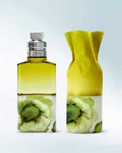 Luxury perfume bottle with green marble pattern and yellow accents, ideal for premium branding.