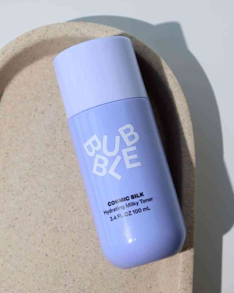 A minimalist hydrating toner in a lavender bottle designed for skincare routines.