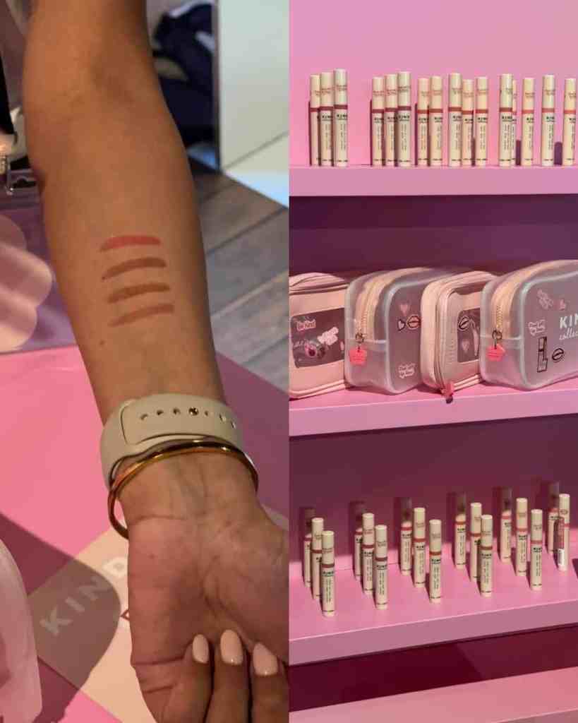 ALT: Swatches of different lipstick shades on arm at White Rabbit Social event.