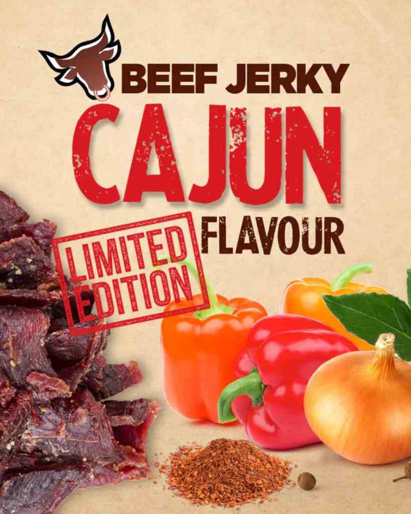 Close-up of beef jerky with red and orange bell peppers, spices, and onion for Cajun beef jerky.