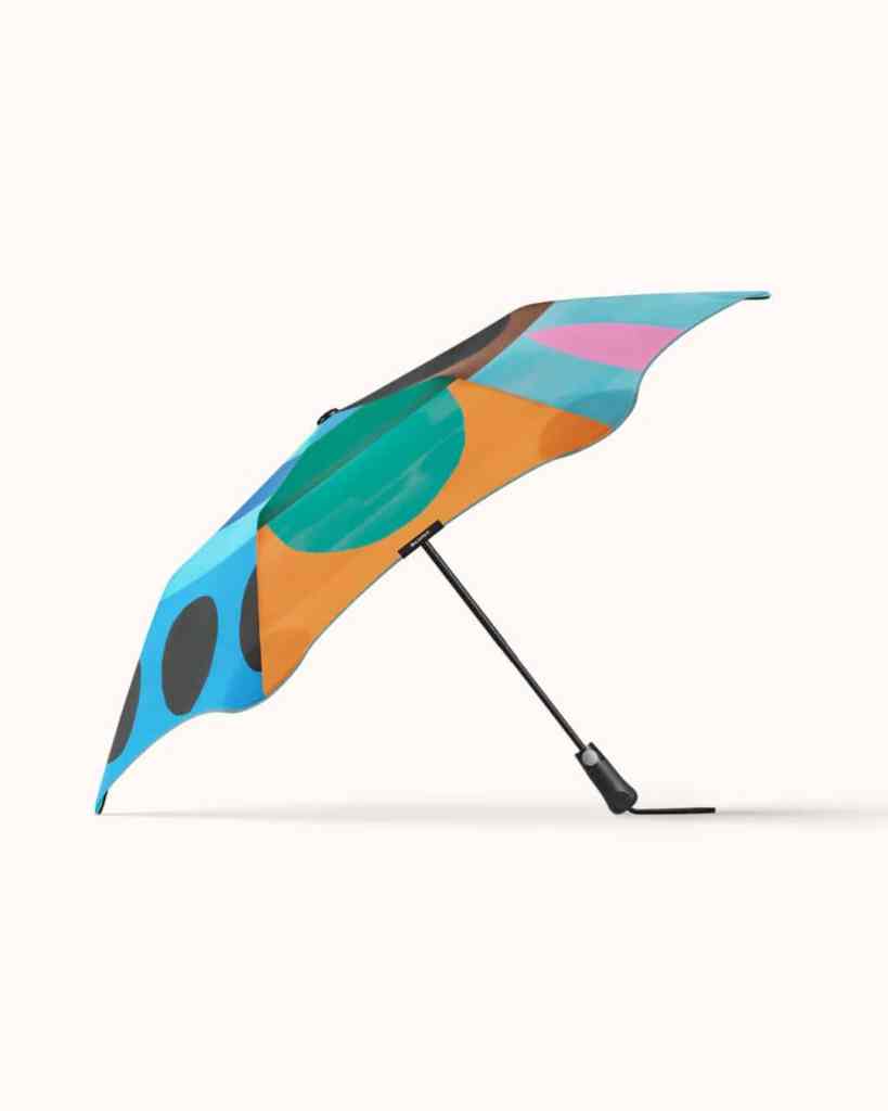 Vibrant, modern umbrella with colourful geometric patterns, perfect for sunny days and fashionable outdoor accessories.