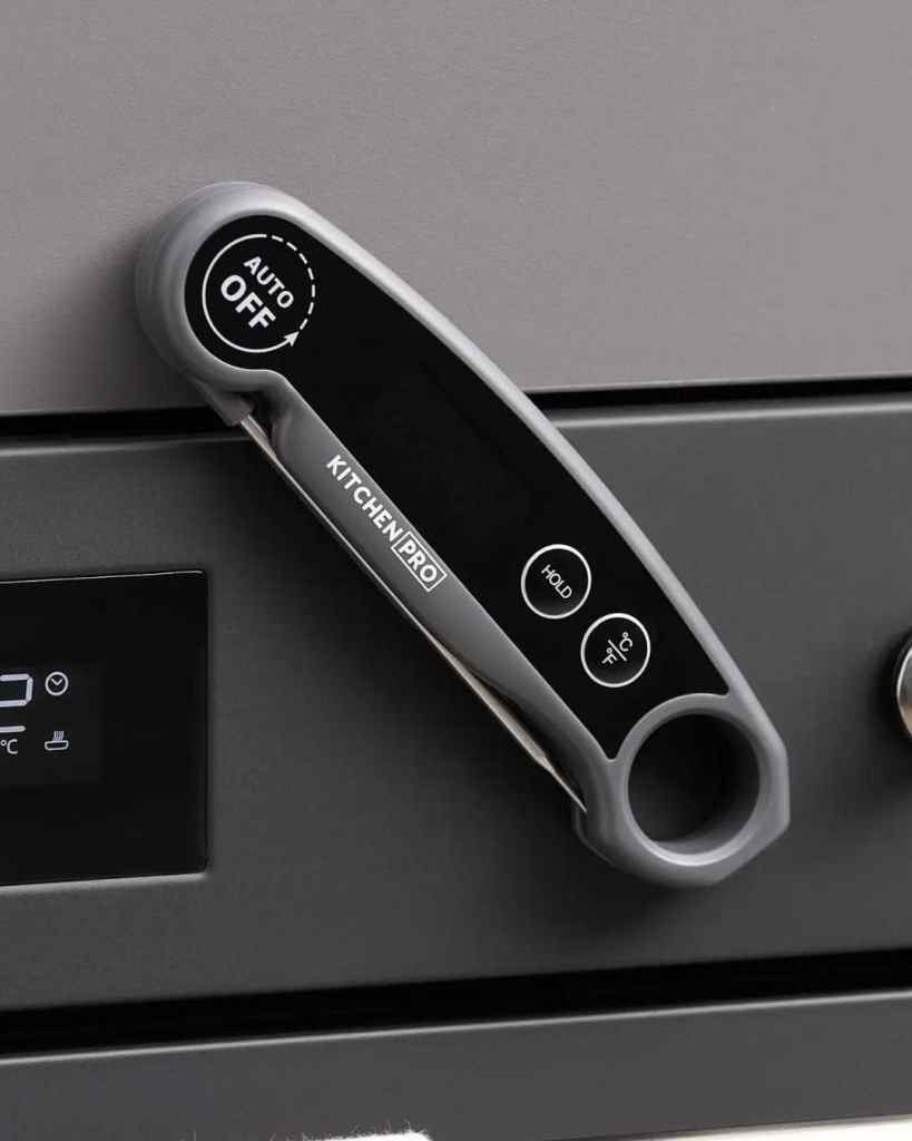 Image of a modern KitchenPro wireless oven control panel with touch buttons and digital display.