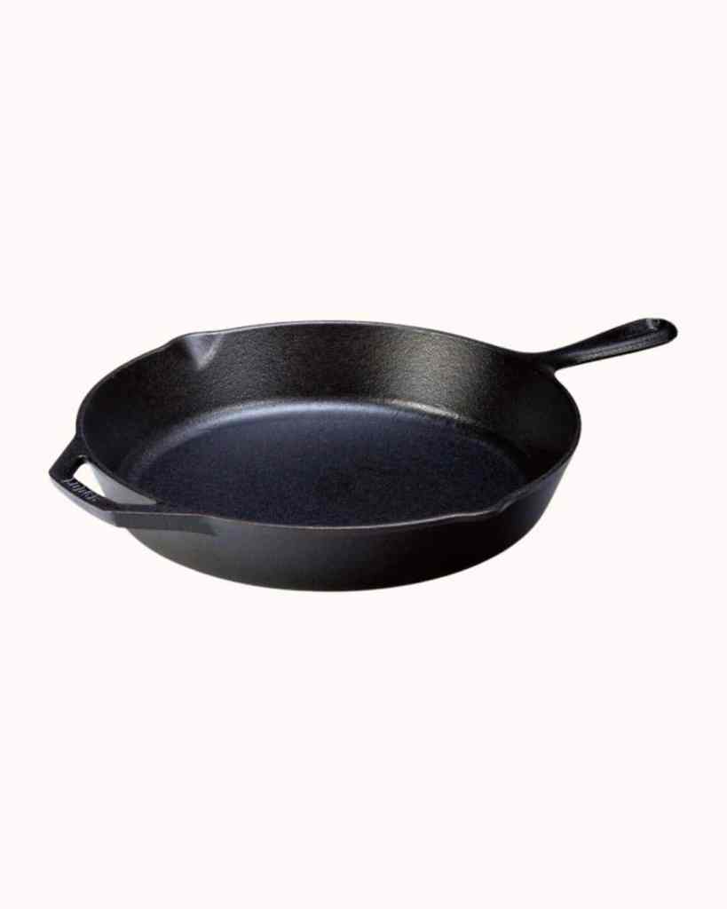 Durable black cast iron frying pan for versatile cooking and stovetop use.