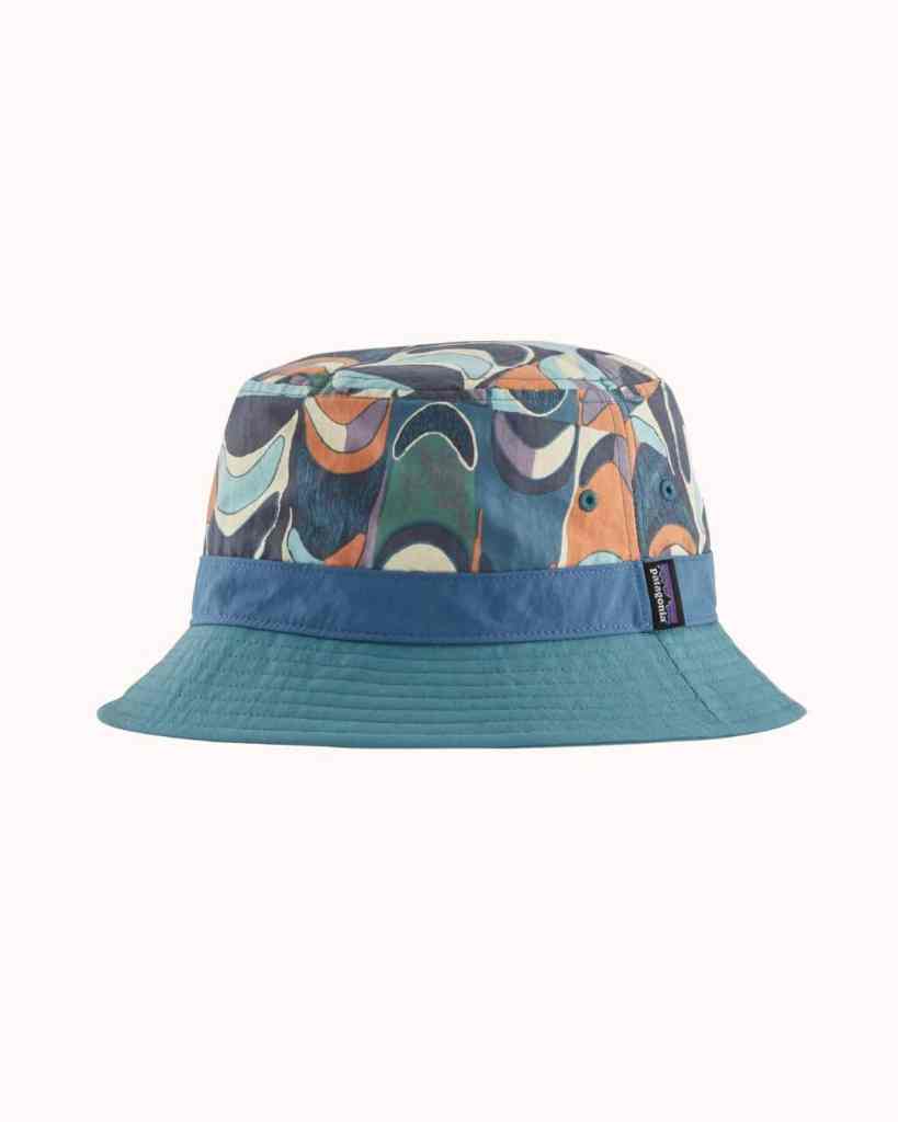 Fashionable bucket hat featuring a vibrant, abstract pattern and brand logo label for outdoor and casual wear.