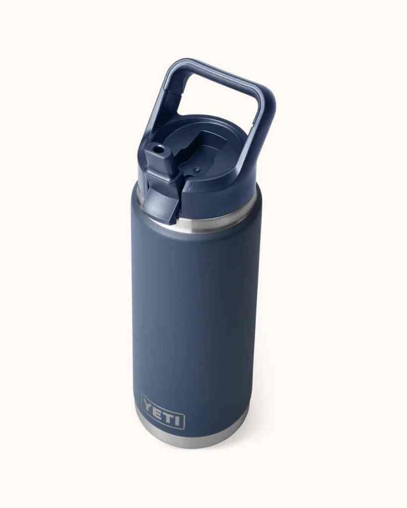 Reusable insulated water bottle with locking lid, ideal for travel and outdoor activities.