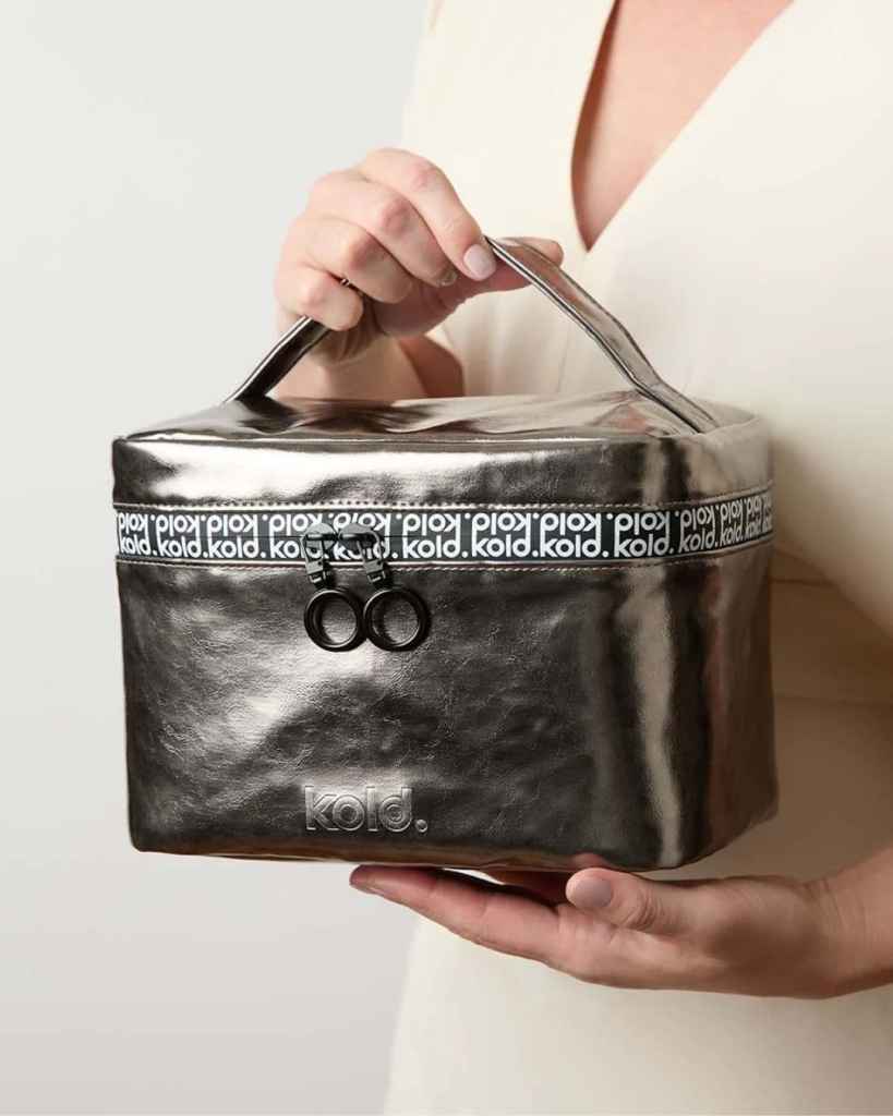 Stylish black Kold cooler bag with zip closure and logo detail, ideal for food and drink storage.