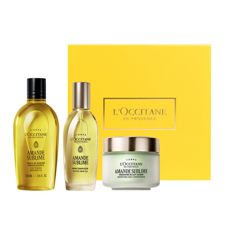 Iconic Almond Collection with Almond Shower Oil 250ml, Almond Supple Skin Oil 100ml, Almond Milk Concentrate 200ml with yellow box on a white background from L'Occitane.