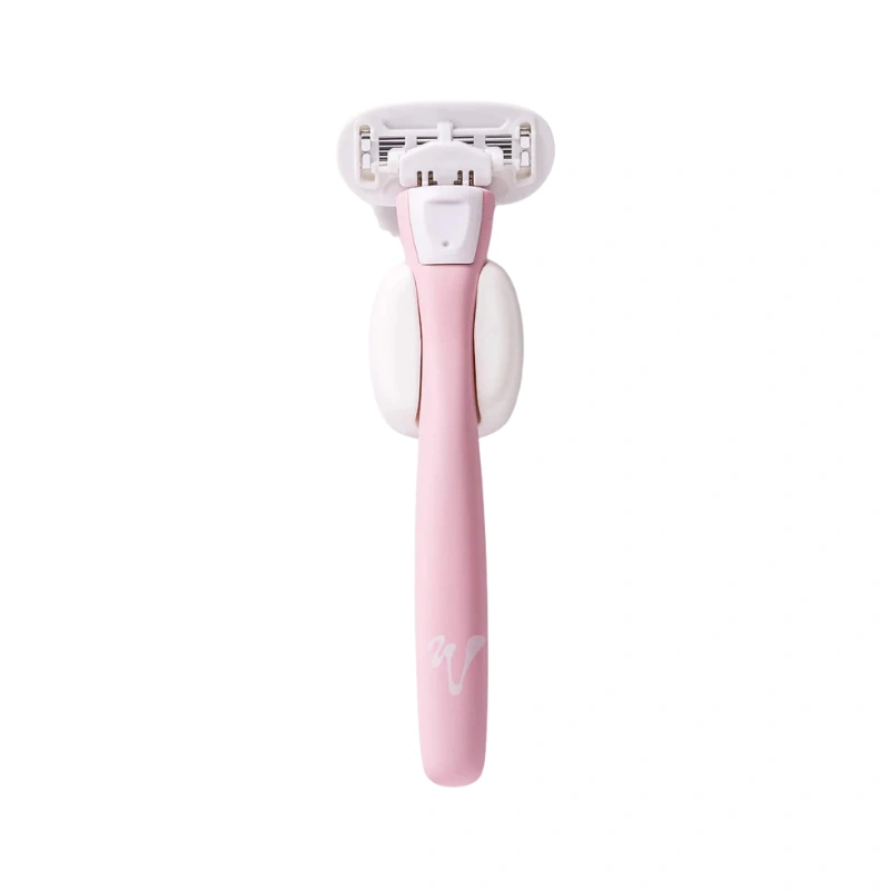 Pink razor from Vivre on a white background.