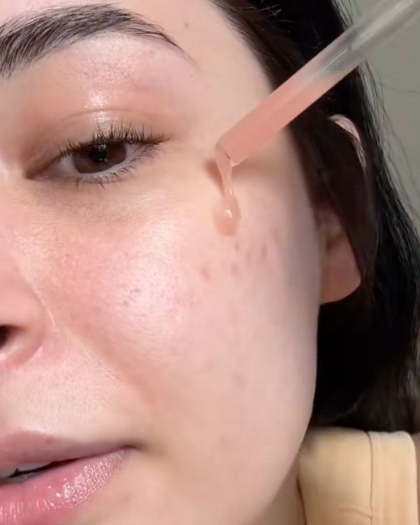 Applying La Roche-Posay Mela B3 serum to the skin