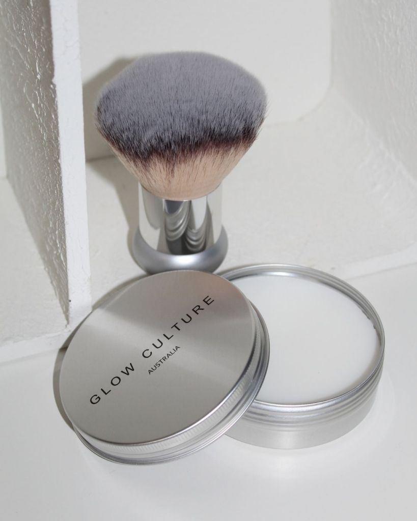 Glow Culture solid brush cleaner with a kabuki makeup brush
