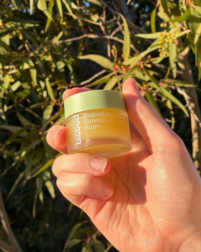 biobod Probiotic Salvation Balm held up outdoors