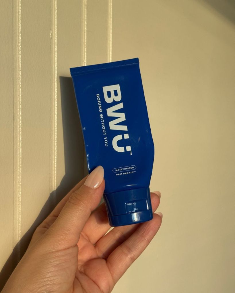 Boring Without You REM Repair Moisturiser tube held in hand